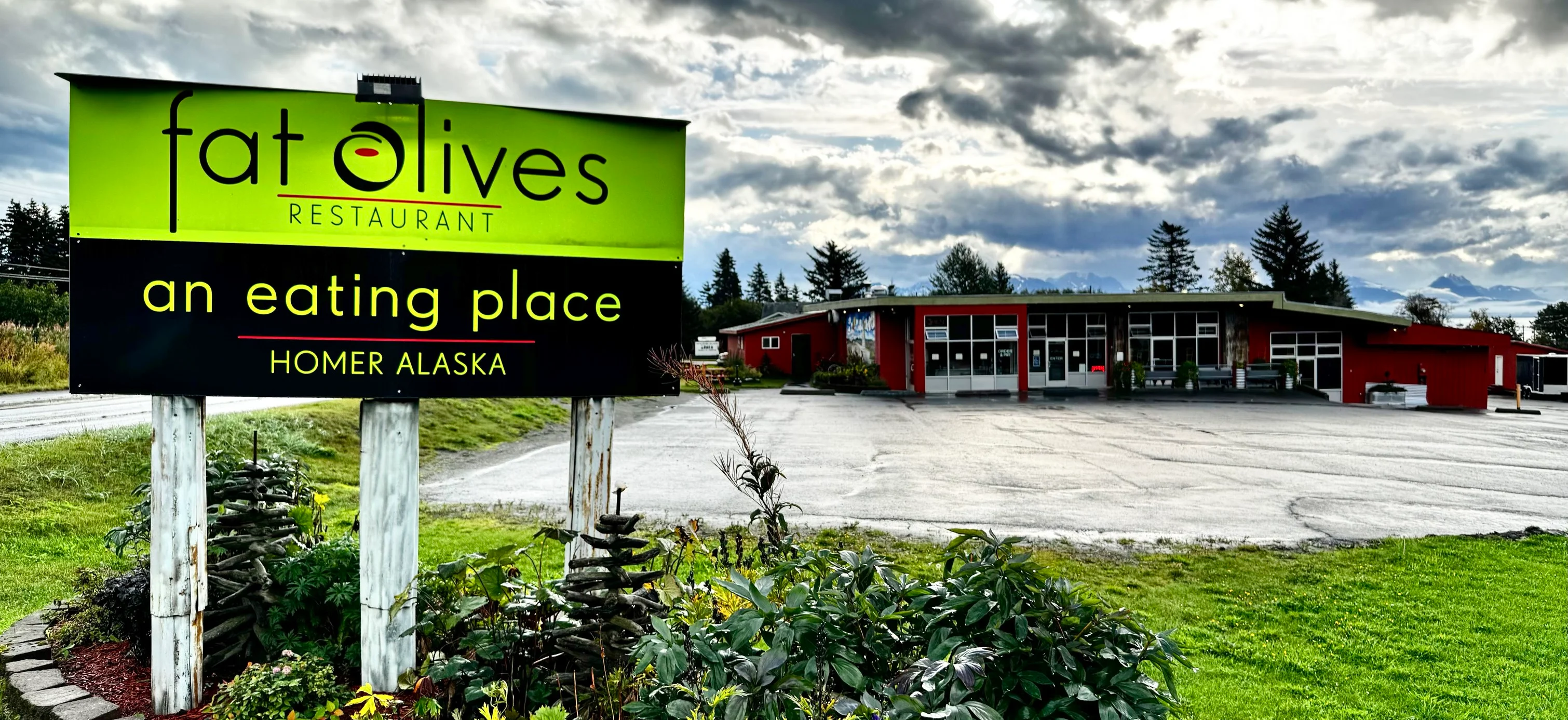 Fat Olives Restaurant exterior and wood-fired oven sign in Homer, Alaska